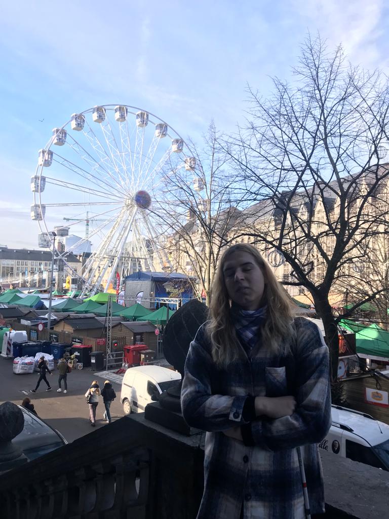 Patricia in front of a panoramic wheel in Liege