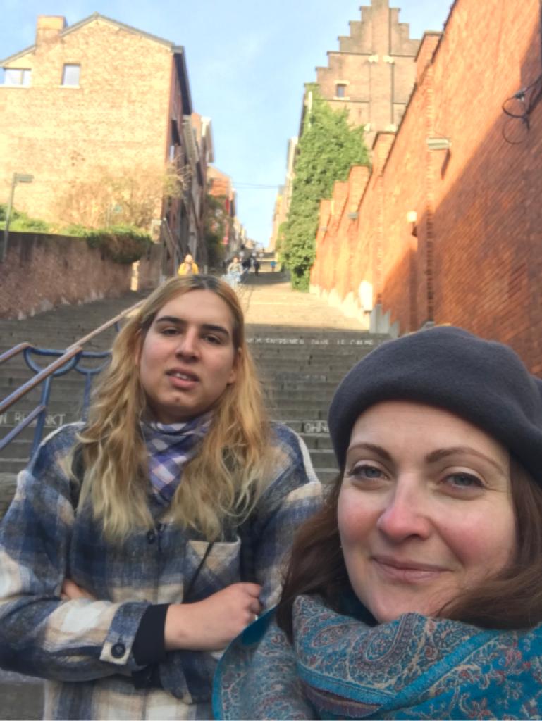 Patricia and Anca taking a selfie on a staircase