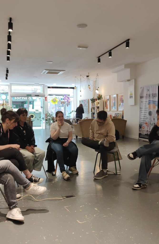 Participants sitting in the venue, interacting