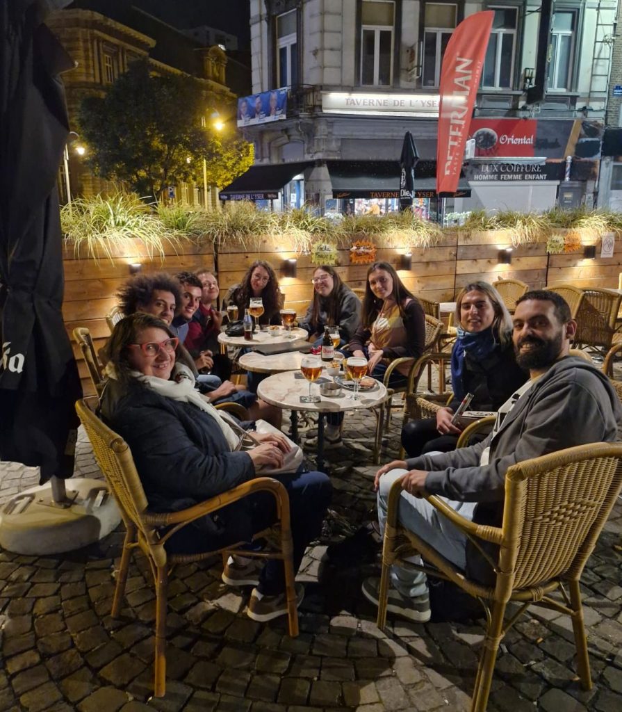 A group of participants sitting outside, having dinner