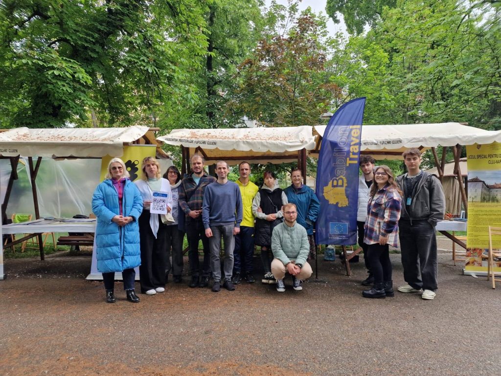 Group photo of participants in front of the stand