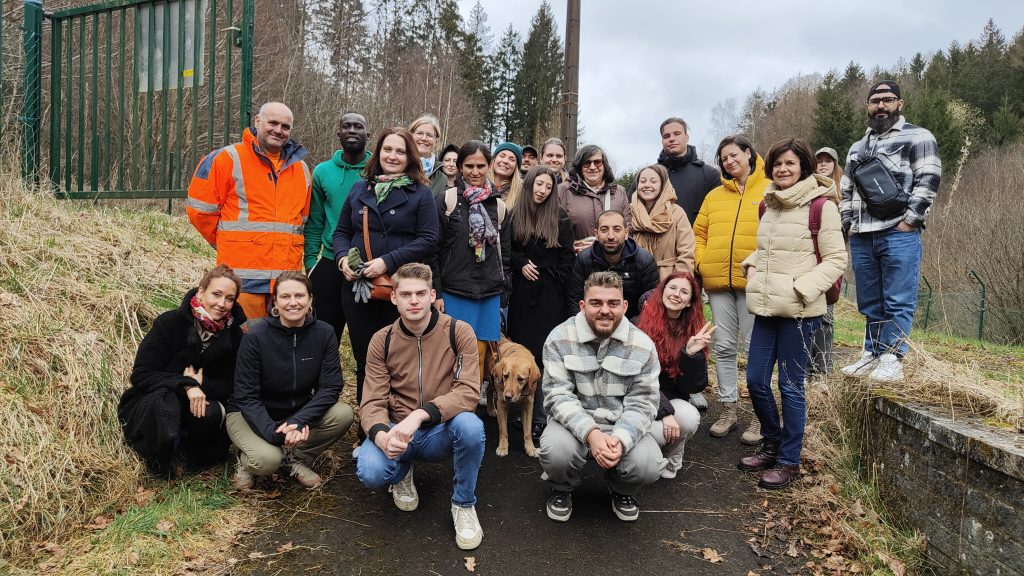 Inclusion for All - participants posing for a picture next to the water collection facility in Bouillon, Belgium