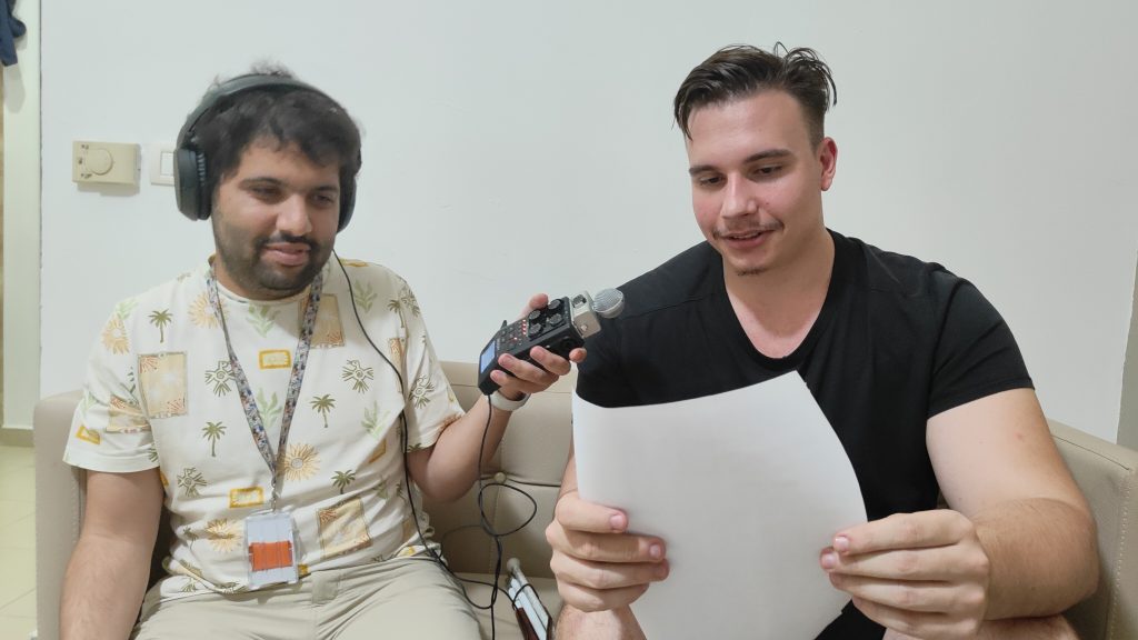 Youssri interviewing Silviu with recording equipment