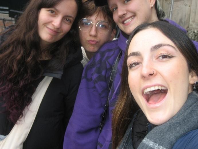 Selfie of Caroline with her 3 housemates, all smiling